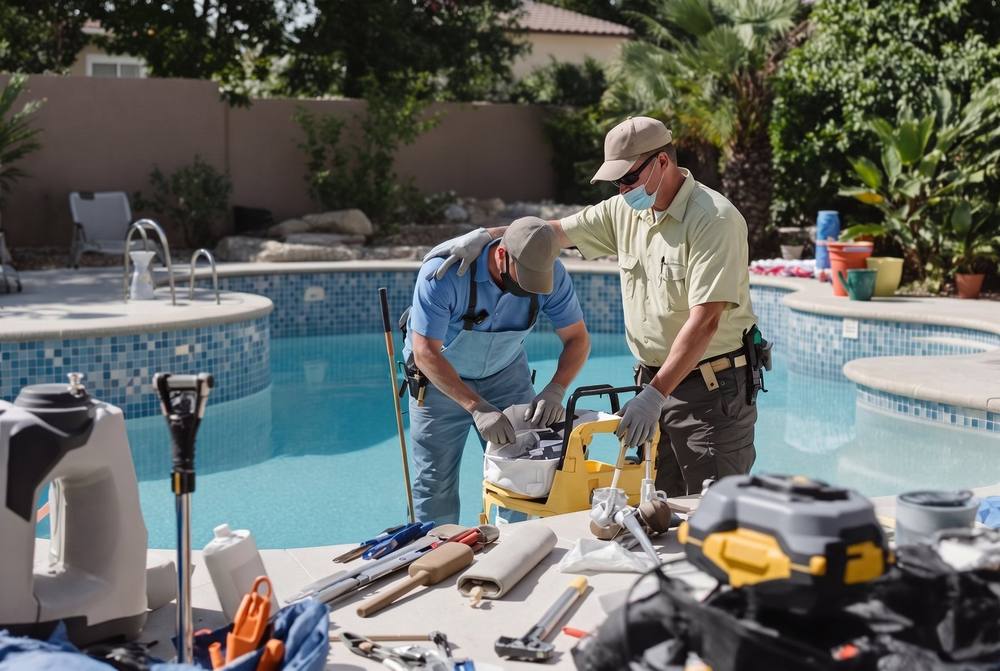 Professional pool technician testing water chemistry at a residential pool in Summerlin, Nevada